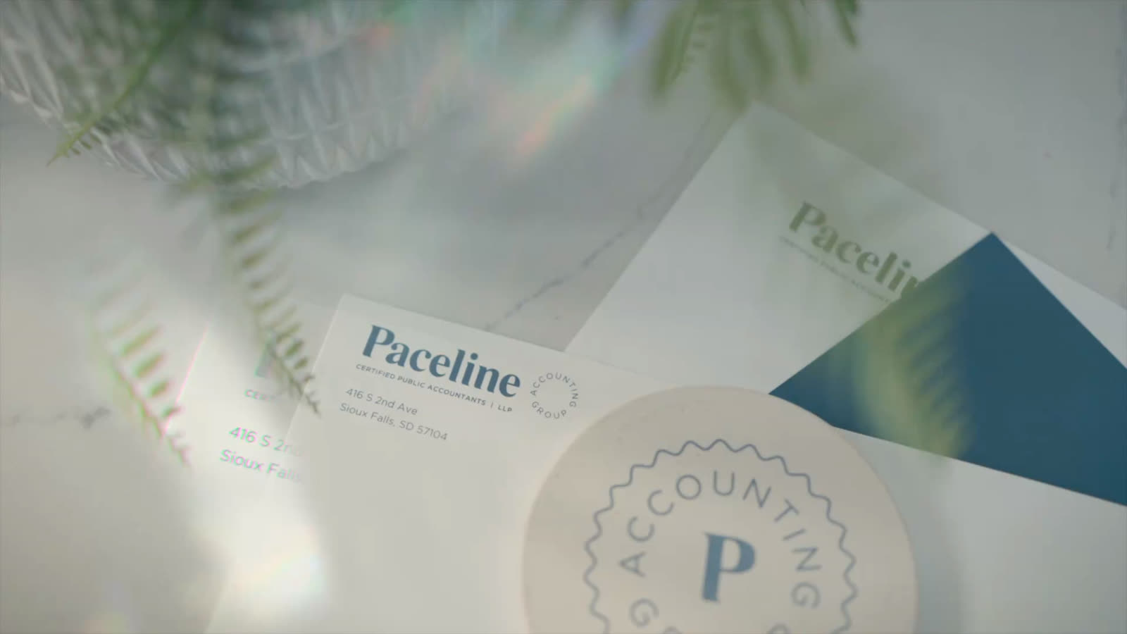 Paceline letterhead and firm seal on a desk